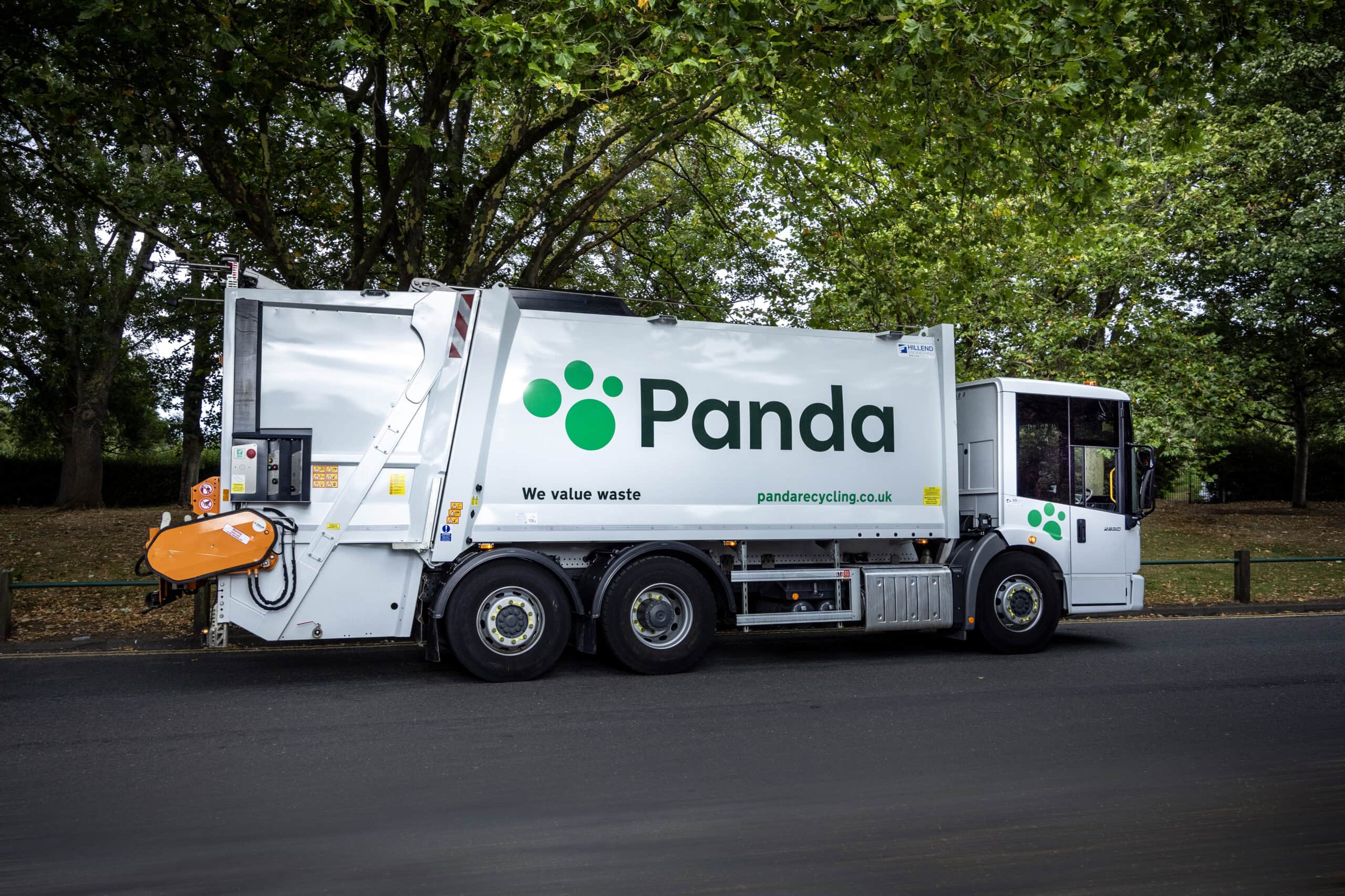 Panda truck on a leafy street